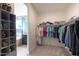 Large walk-in closet with ample shelving and hanging space at 18404 W Long Lake Rd, Goodyear, AZ 85338