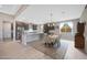 Bright dining area with chandelier and view of kitchen and Gathering room at 18404 W Long Lake Rd, Goodyear, AZ 85338