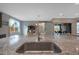 Kitchen island with granite countertop and stainless steel sink at 18404 W Long Lake Rd, Goodyear, AZ 85338