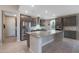 Spacious kitchen with granite island, stainless steel appliances, and white subway tile backsplash at 18404 W Long Lake Rd, Goodyear, AZ 85338