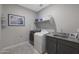 Laundry room with washer, dryer, and sink at 18404 W Long Lake Rd, Goodyear, AZ 85338