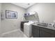 Laundry room with washer, dryer and granite countertop at 18404 W Long Lake Rd, Goodyear, AZ 85338