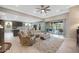 Living room with sliding doors to backyard and view of kitchen at 18404 W Long Lake Rd, Goodyear, AZ 85338