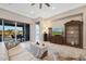 Living room with sliding glass doors to the backyard at 18404 W Long Lake Rd, Goodyear, AZ 85338