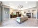 Relaxing living room with ceiling fan and patio access at 18404 W Long Lake Rd, Goodyear, AZ 85338