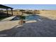 Sparkling pool with well manicured deck and mature landscaping at 18404 W Long Lake Rd, Goodyear, AZ 85338