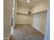 Spacious walk-in closet with ample shelving and rod space for organized storage at 18404 W Long Lake Rd, Goodyear, AZ 85338