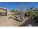 Landscaped backyard with a fire pit and patio furniture at 18509 N Toya St, Maricopa, AZ 85138