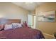 Serene bedroom with a queen bed and a rocking chair at 18509 N Toya St, Maricopa, AZ 85138