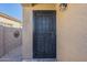 Black metal security door with a glass insert, enhancing curb appeal at 18509 N Toya St, Maricopa, AZ 85138