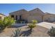 Charming one-story home with a welcoming front porch and neatly landscaped yard at 18509 N Toya St, Maricopa, AZ 85138