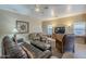 Relaxing living room with ample seating and a large flat-screen TV at 18509 N Toya St, Maricopa, AZ 85138