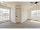 Well-lit bedroom with large windows and carpet flooring at 19241 N 4Th Pl, Phoenix, AZ 85024