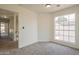 Spacious bedroom with large window and plush carpeting at 19241 N 4Th Pl, Phoenix, AZ 85024