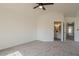 Primary bedroom with ensuite bathroom and ceiling fan at 19241 N 4Th Pl, Phoenix, AZ 85024