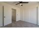 Spacious bedroom with ceiling fan and double closet at 19241 N 4Th Pl, Phoenix, AZ 85024