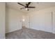 Cozy bedroom with ceiling fan and carpet flooring at 19241 N 4Th Pl, Phoenix, AZ 85024