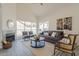 Open living room featuring a fireplace and large windows at 19241 N 4Th Pl, Phoenix, AZ 85024