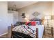 Charming bedroom with a queen bed and decorative wall art at 19778 N Coyote Lakes Pkwy, Surprise, AZ 85378