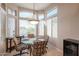 Bright breakfast nook with glass table and view to backyard at 19778 N Coyote Lakes Pkwy, Surprise, AZ 85378