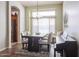 Dining room with hardwood floors and a modern chandelier at 19778 N Coyote Lakes Pkwy, Surprise, AZ 85378