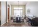 Dining room with hardwood floors and a modern chandelier at 19778 N Coyote Lakes Pkwy, Surprise, AZ 85378