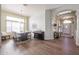 Dining area with hardwood floors, chandelier, and access to entry and kitchen at 19778 N Coyote Lakes Pkwy, Surprise, AZ 85378