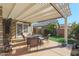 Covered patio with seating area and fire pit at 19778 N Coyote Lakes Pkwy, Surprise, AZ 85378