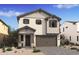 Two-story home with neutral siding and a two-car garage at 2060 N Woodburne Pl, Chandler, AZ 85224