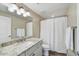 Updated bathroom with granite vanity, shower, and modern fixtures at 20660 N 40Th St # 2159, Phoenix, AZ 85050