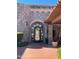 Elegant home entrance with arched stone details at 20660 N 40Th St # 2159, Phoenix, AZ 85050