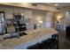 Open concept kitchen with granite island and breakfast bar at 20660 N 40Th St # 2159, Phoenix, AZ 85050