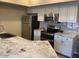 Modern kitchen with granite countertops and stainless steel appliances at 20660 N 40Th St # 2159, Phoenix, AZ 85050