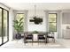 Bright dining room with marble top table and modern chandelier at 2090 N Woodburne Pl, Chandler, AZ 85224