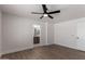 Spacious bedroom with wood-look floors, ceiling fan and en-suite bathroom at 2193 S Tucana Ln, Gilbert, AZ 85295