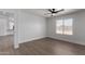 Well-lit bedroom with wood-look floors and a view of the backyard at 2193 S Tucana Ln, Gilbert, AZ 85295