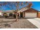 Brick home with a two-car garage and landscaped front yard at 2193 S Tucana Ln, Gilbert, AZ 85295