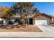 Brick home with landscaped yard and two-car garage at 2193 S Tucana Ln, Gilbert, AZ 85295