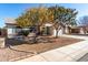 Beautiful brick home with a two-car garage and mature trees at 2193 S Tucana Ln, Gilbert, AZ 85295