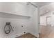 Bright laundry room with shelving and vinyl flooring at 2193 S Tucana Ln, Gilbert, AZ 85295