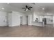 Open living room with kitchen island and hardwood floors at 2193 S Tucana Ln, Gilbert, AZ 85295