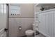 Small bathroom with toilet, white cabinetry, and wavy tile at 21987 E Stacey Rd, Queen Creek, AZ 85142