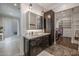 Spa-like bathroom features a modern vanity, walk-in closet, and marble countertops at 21987 E Stacey Rd, Queen Creek, AZ 85142