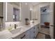 Double vanity bathroom with marble countertops and modern lighting at 21987 E Stacey Rd, Queen Creek, AZ 85142