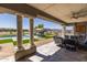 Relaxing covered patio overlooking the pool and backyard, perfect for outdoor dining at 21987 E Stacey Rd, Queen Creek, AZ 85142