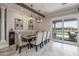 Bright dining room with wooden table, sliding doors to backyard, and chandelier at 21987 E Stacey Rd, Queen Creek, AZ 85142