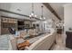 Elegant dining area with a large wooden table and access to the living room and kitchen at 21987 E Stacey Rd, Queen Creek, AZ 85142