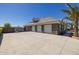 Spacious three-car garage with stone exterior and ample driveway space at 21987 E Stacey Rd, Queen Creek, AZ 85142