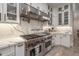 White kitchen with stainless steel appliances and marble countertops at 21987 E Stacey Rd, Queen Creek, AZ 85142