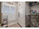 Laundry room with white cabinets, tile flooring and built-in shelving at 21987 E Stacey Rd, Queen Creek, AZ 85142